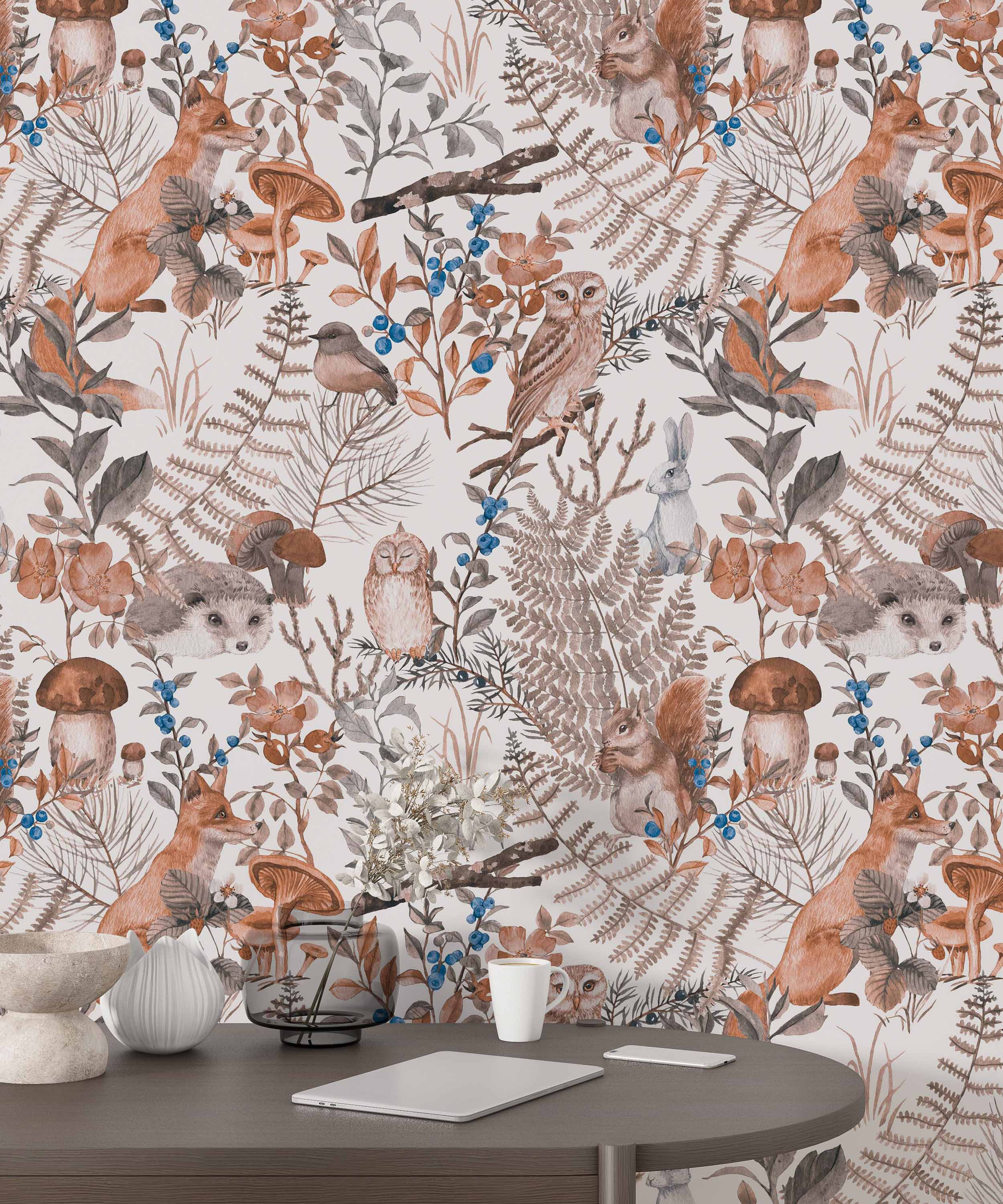 Watercolor woodland wallpaper featuring foxes, squirrels, owls, ferns, and berries in muted brown, gray, orange, and blue tones.