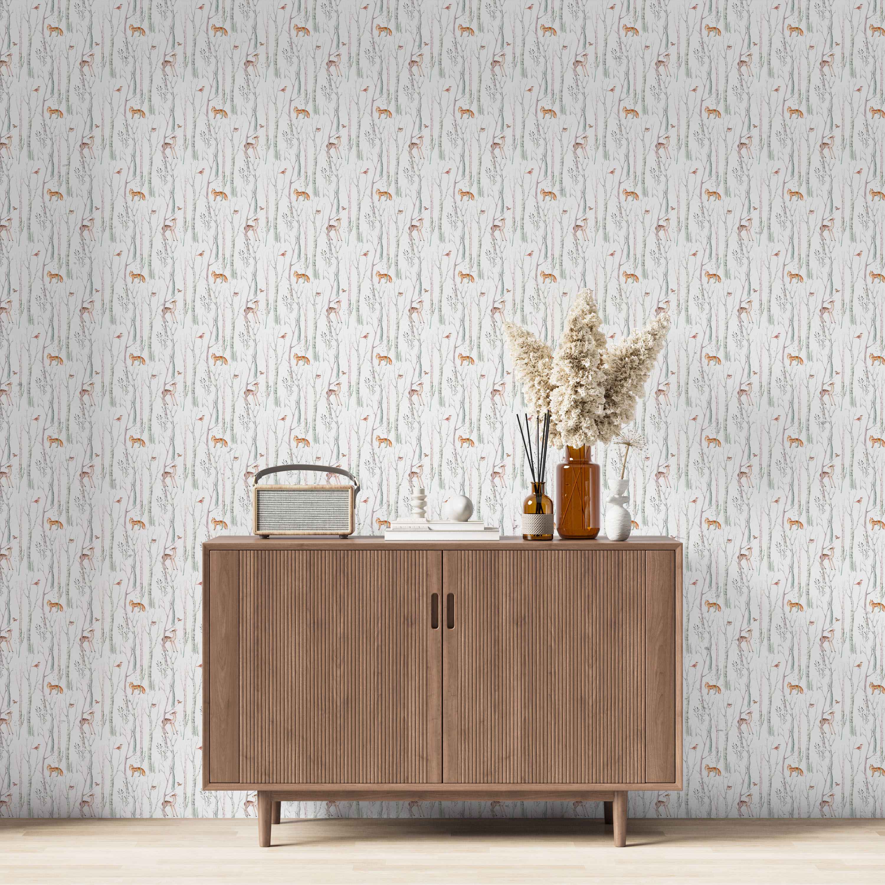 Watercolor woodland wallpaper featuring illustrated birch trees, orange foxes, brown deer, and small birds on a white background.