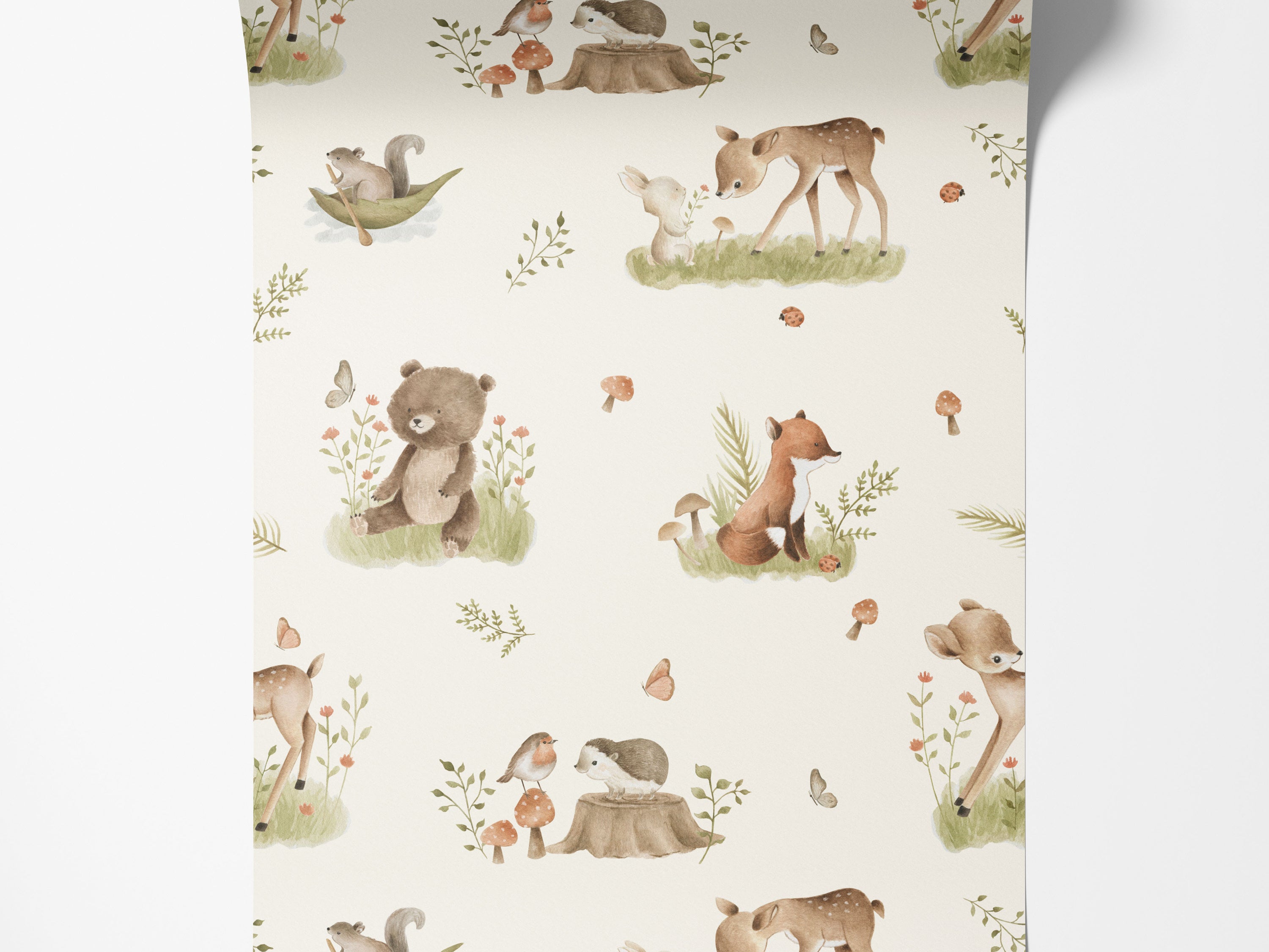 Wallpaper with a charming watercolor pattern of woodland animals including deer, bears, and foxes, set amongst foliage and mushrooms.