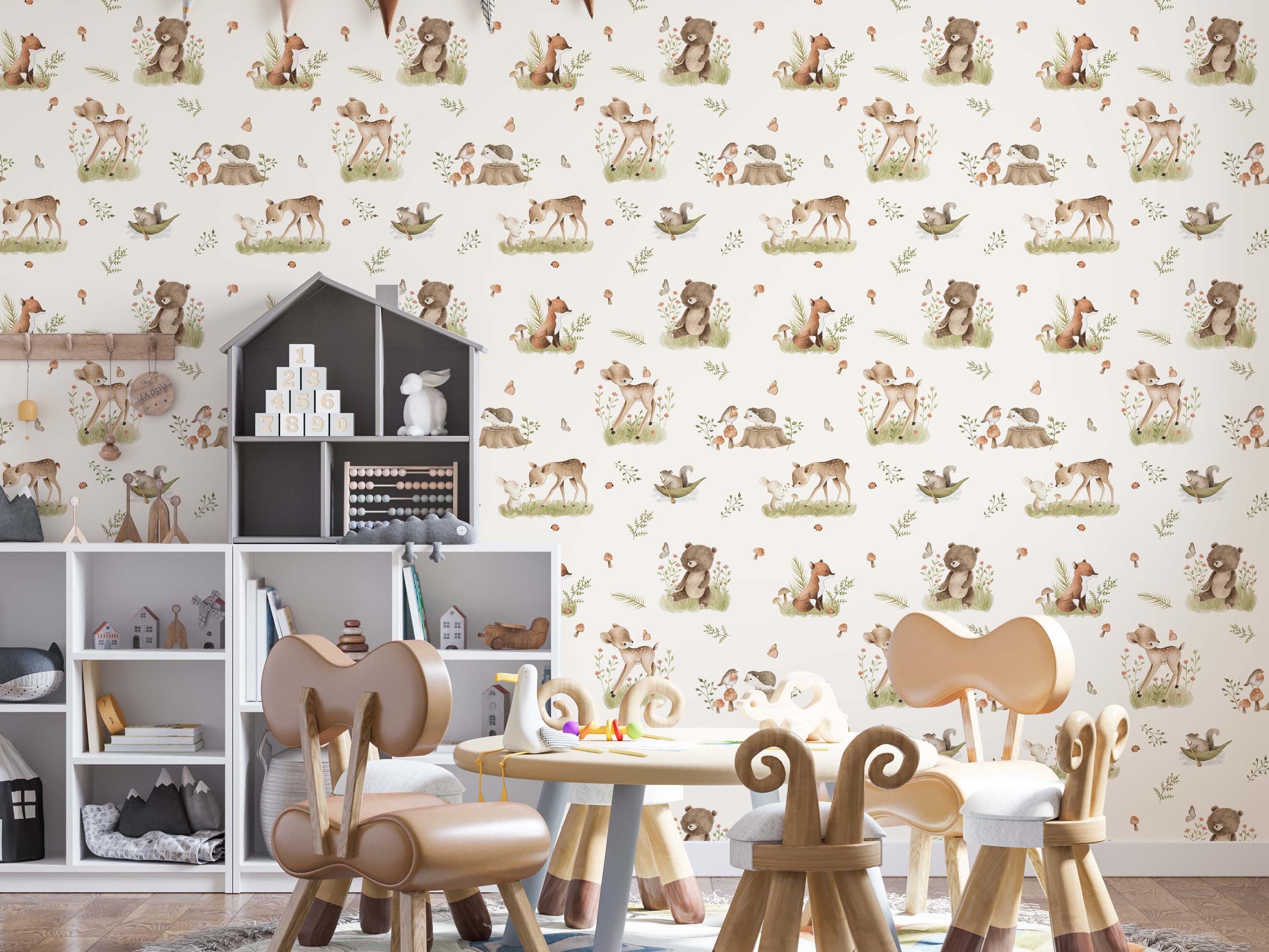 Watercolor wallpaper with a repeating pattern of woodland animals like deer, bears, and foxes, amongst green leaves and orange mushrooms.