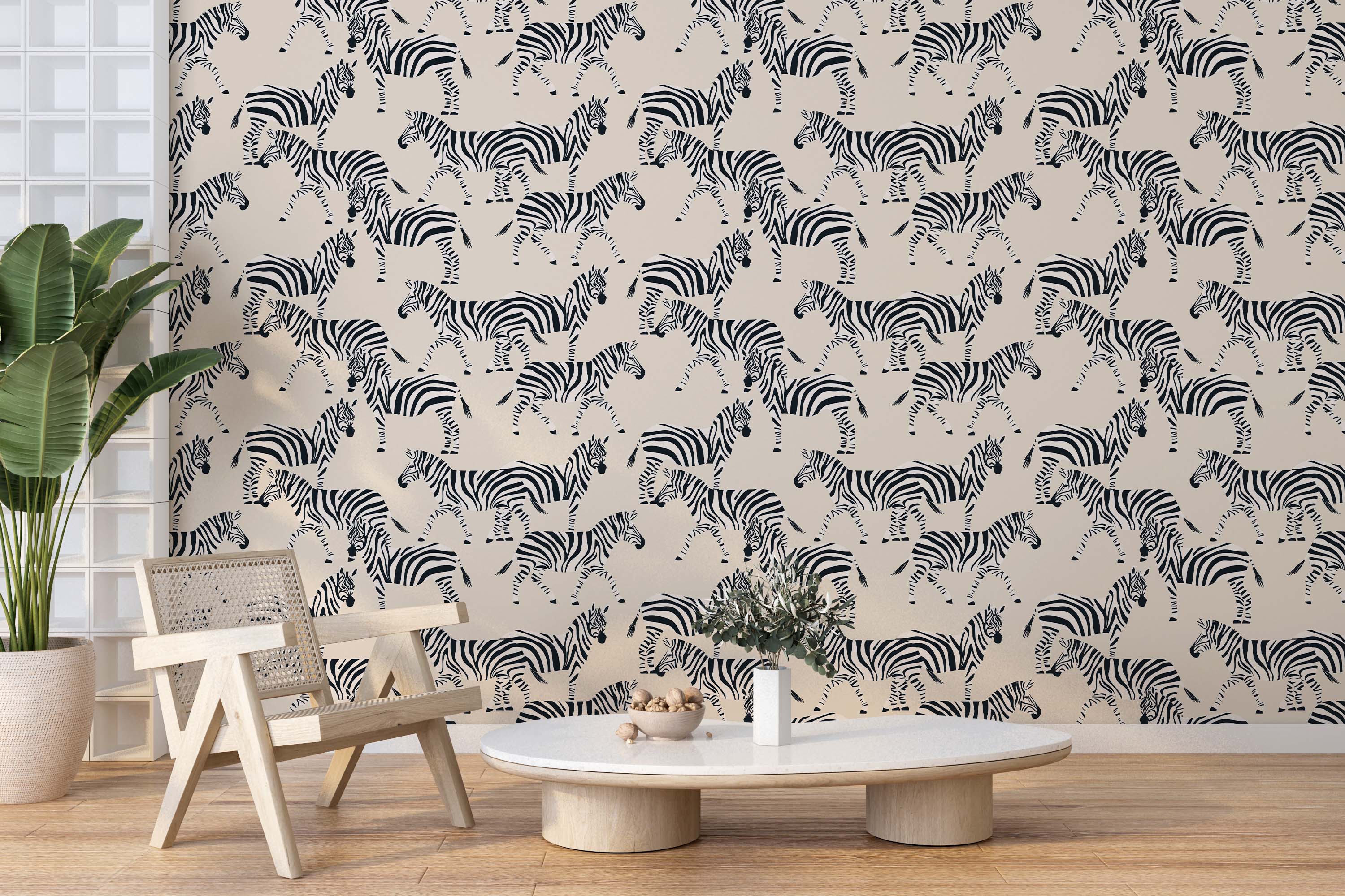 Stylized walking zebras in a black and white print create a repeating pattern on this light beige wallpaper.
