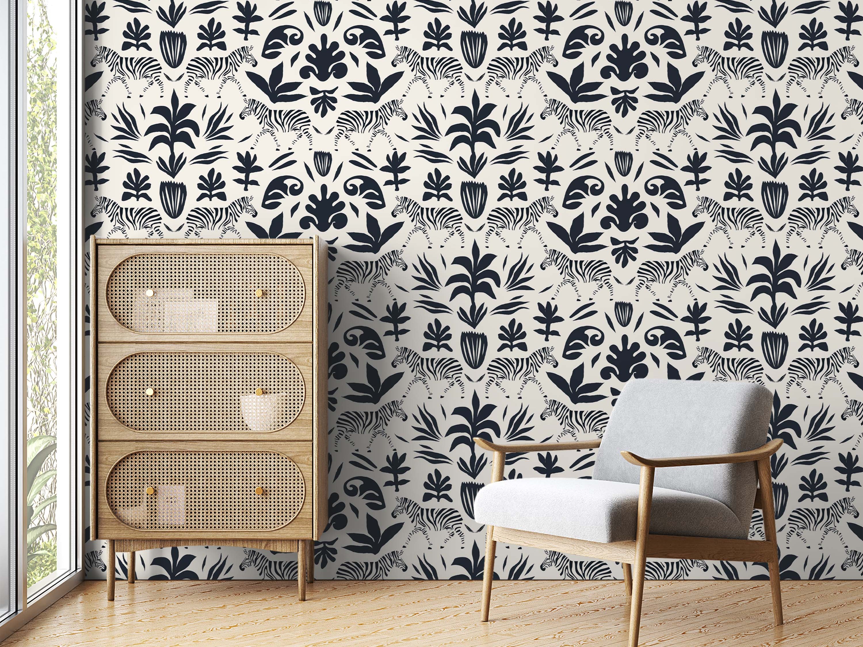 Cream wallpaper featuring a repeating pattern of black illustrated zebras and stylized botanical silhouettes.